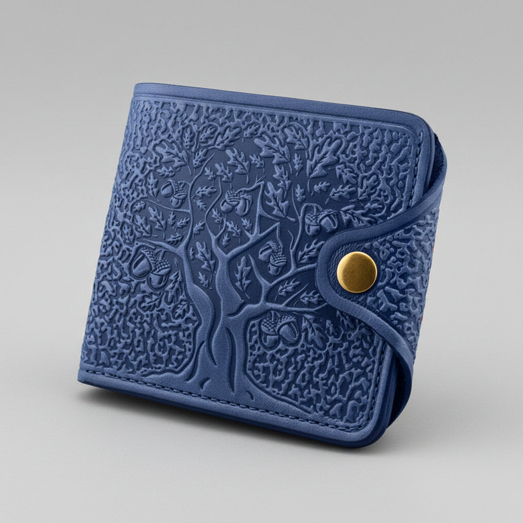 Blue embossed wallet with a gold button on a black background