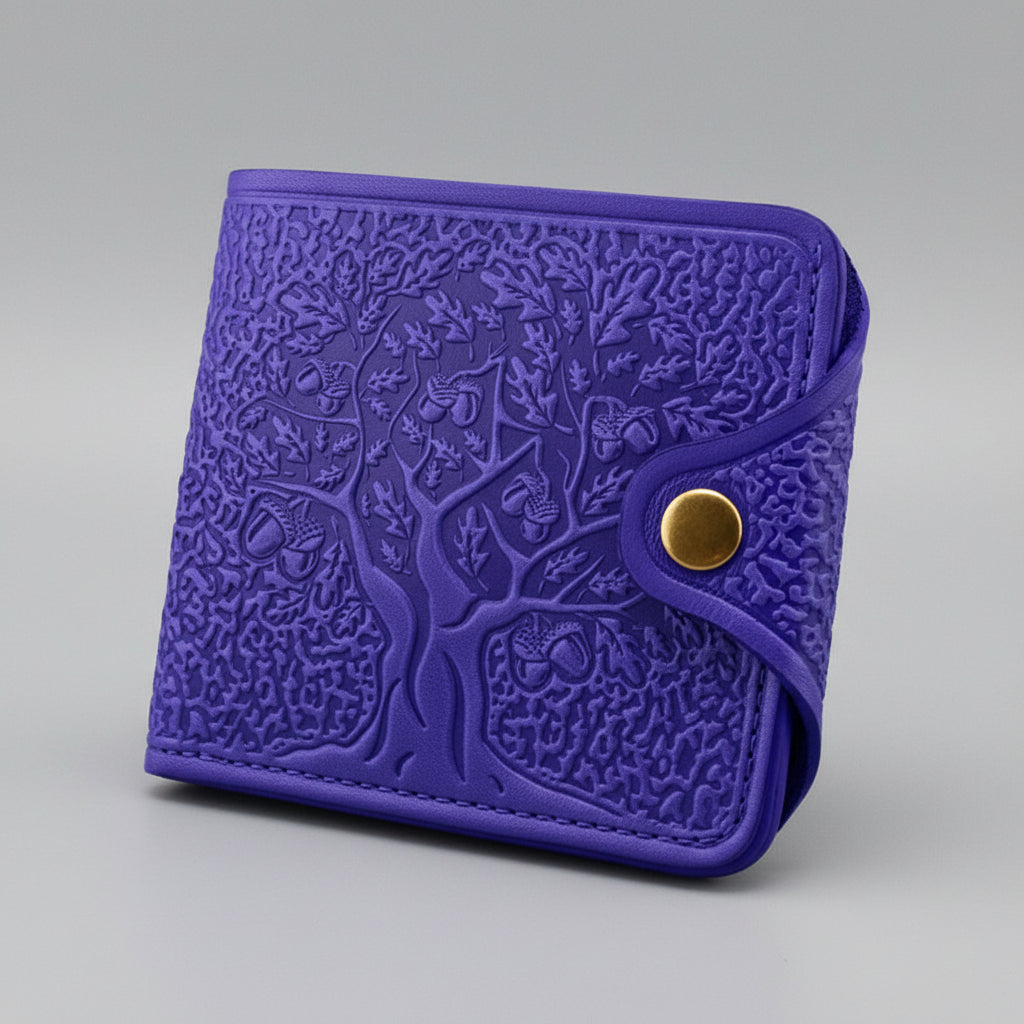 Blue embossed wallet with a gold button on a black background
